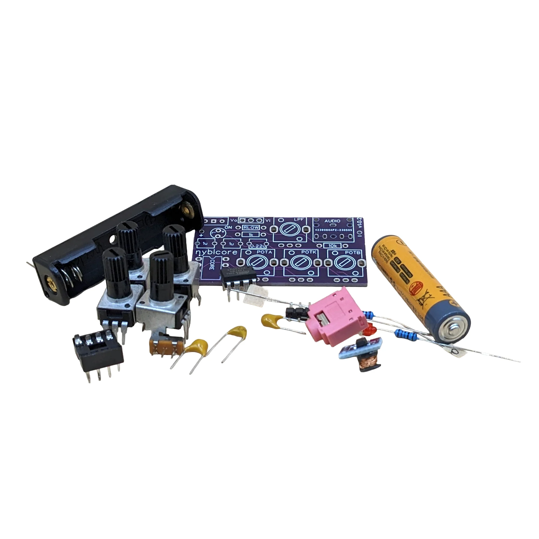 Nyblcore DIY kit parts including PCB, battery holder, knobs, and electronic components